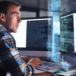 Image of security analyst focusing on computer screen